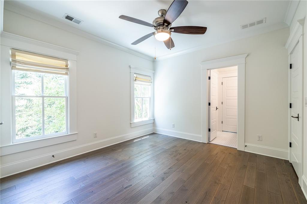 538 Ansley Street Decatur, GA 30030 - Photo 48 of 73 a view of an empty room with wooden floor and a window