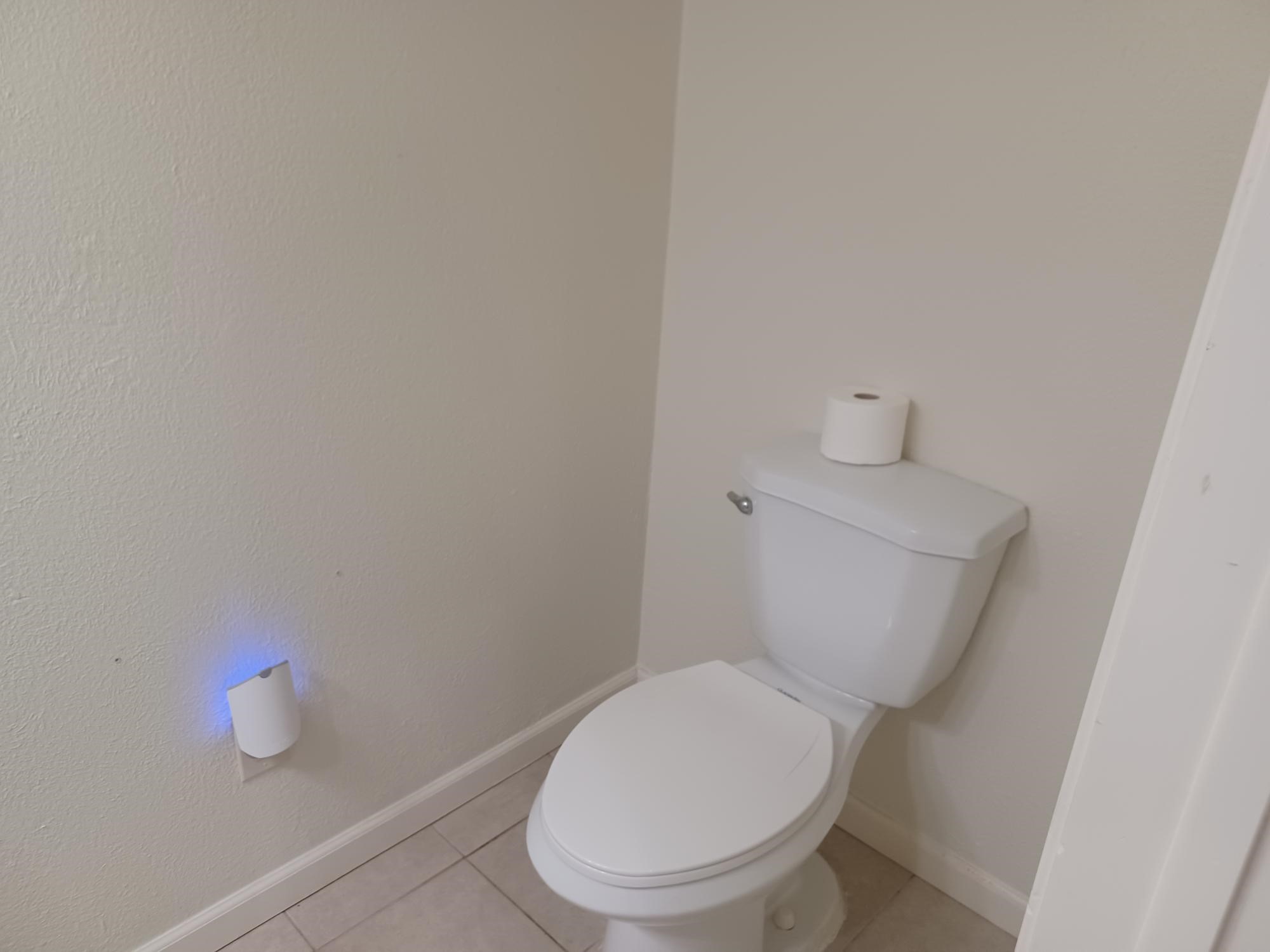 128 April Point Drive South Conroe, TX 77356 - Photo 24 of 26 a white toilet sitting next to a white cabinet