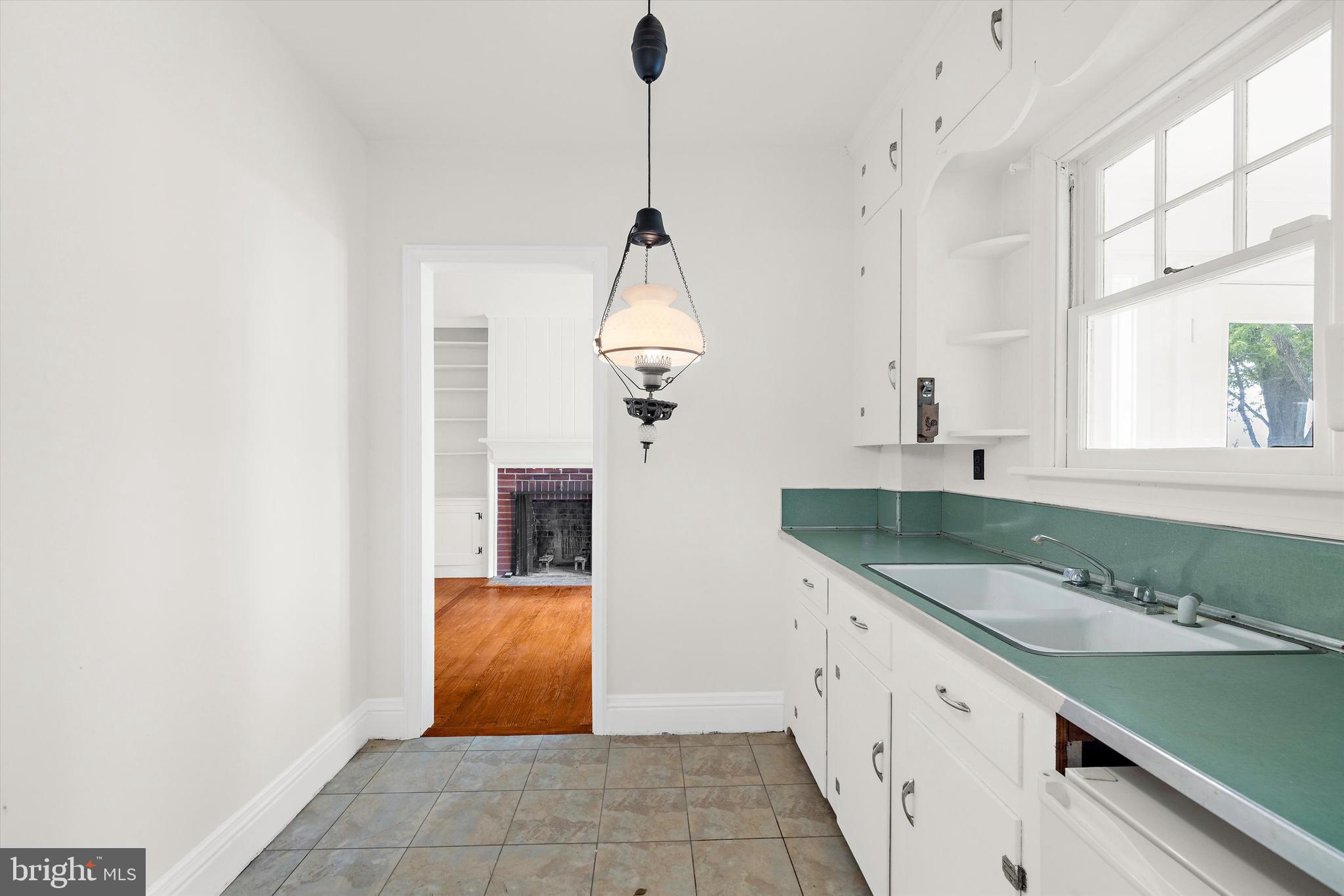 500 Nesbit Road Queenstown, MD 21658 - Photo 12 of 53 a spacious bathroom with a granite countertop sink a mirror and a bathtub