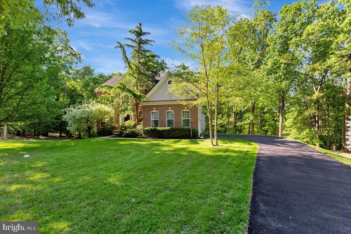 934 Zenith Drive Freeland, MD 21053 - Photo 3 of 50 a front view of a house with a yard