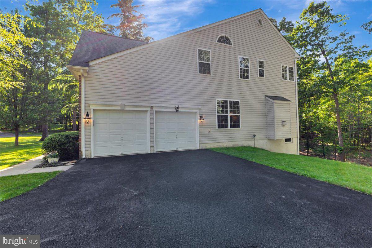 934 Zenith Drive Freeland, MD 21053 - Photo 4 of 50 a view of a house with a yard and a large tree