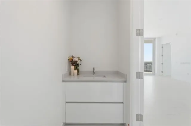 a bathroom with a sink and a mirror