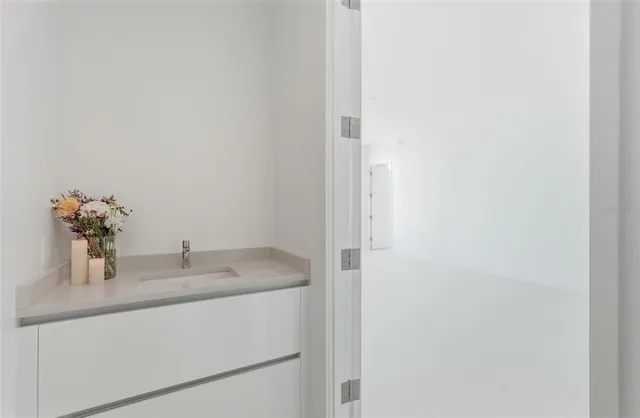 a bathroom with a sink and a mirror