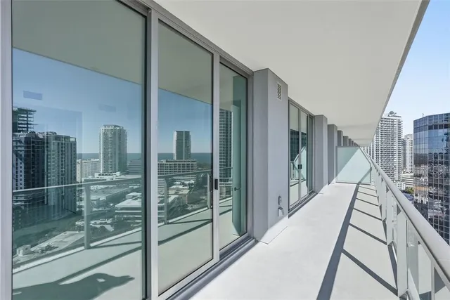 a view of a swimming pool with outdoor seating