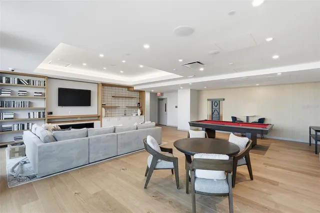 a view of a house with a backyard porch and sitting area