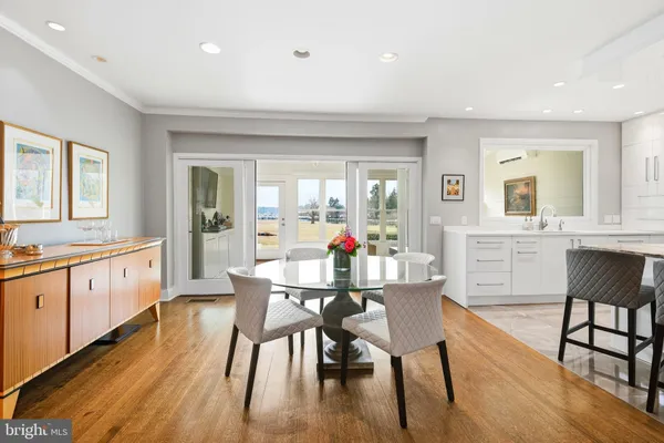 a spacious bedroom with a bed and glass windows