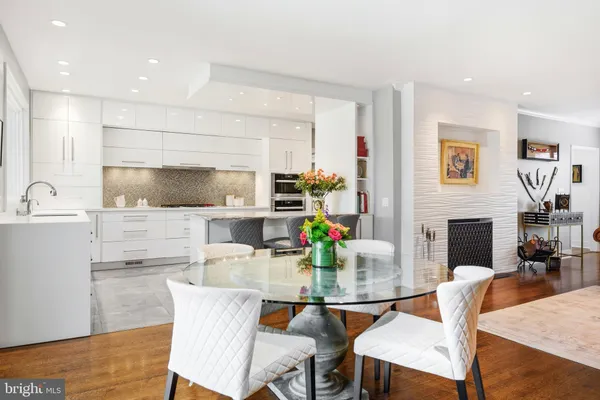 a spacious bedroom with a bed and a fireplace