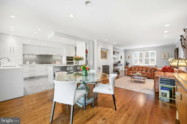 a living room with furniture and floor to ceiling windows