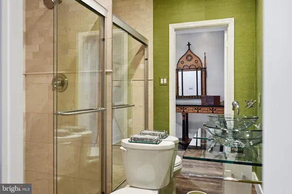 a bathroom with a bathtub and a shower