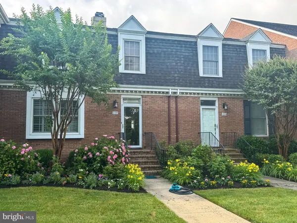 a view of a livingroom with furniture and hardwood floor