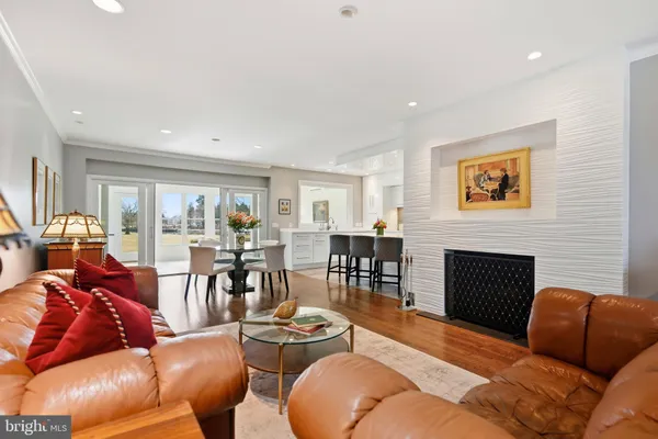 a bedroom with furniture and a mirror