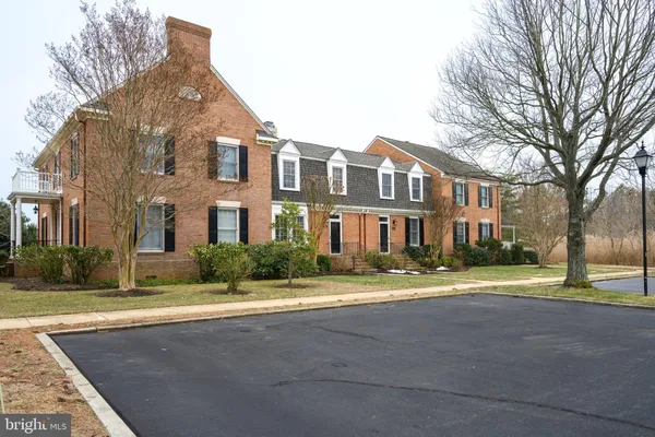 a kitchen with granite countertop cabinets a sink and a stove