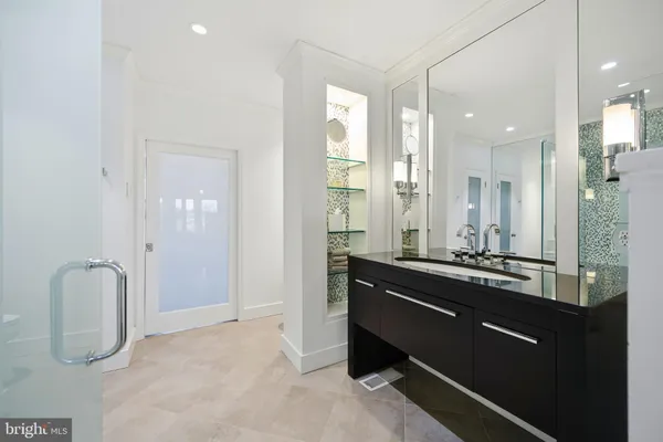 a view of a lake with houses in the background