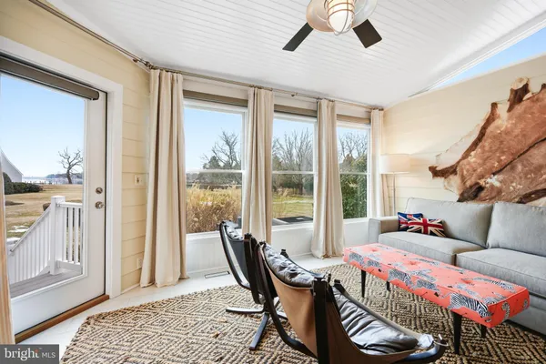 a view of a lake with boats and trees in the background