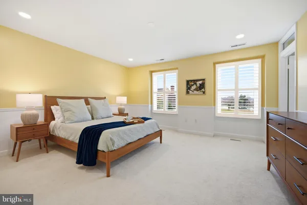 a view of a lake with houses in the back