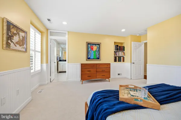 a view of a lake with boats and large trees