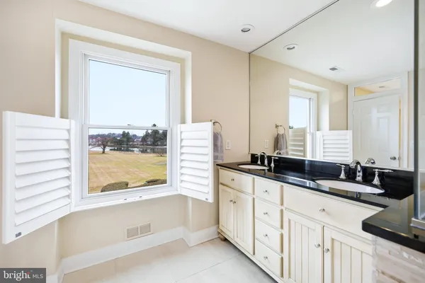 a view of a brick building next to a yard