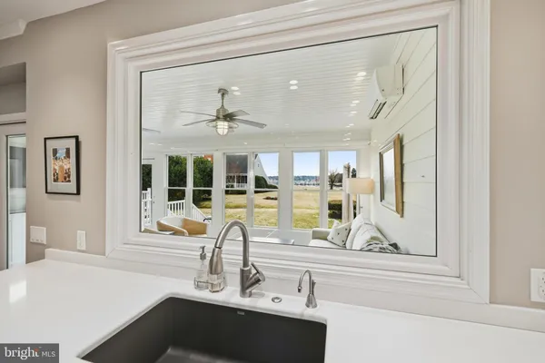 a living room with furniture dining table and wooden floor