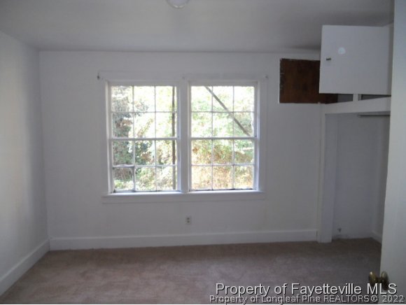 201 Thornton Road Dunn, NC 28334 - Photo 5 of 6 an empty room with a window