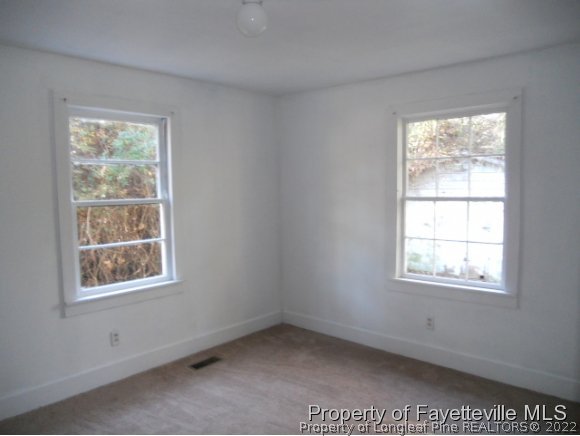 201 Thornton Road Dunn, NC 28334 - Photo 6 of 6 an empty room with a window