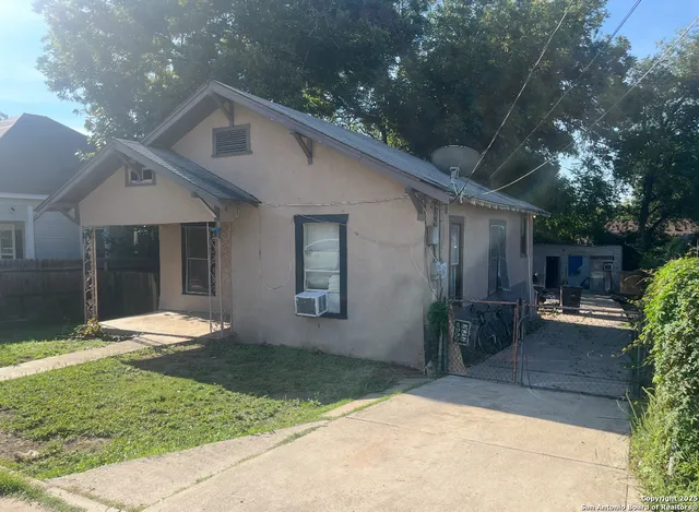 a backyard of a house with seating space