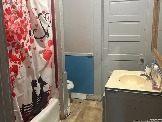 a bathroom with a sink and vanity