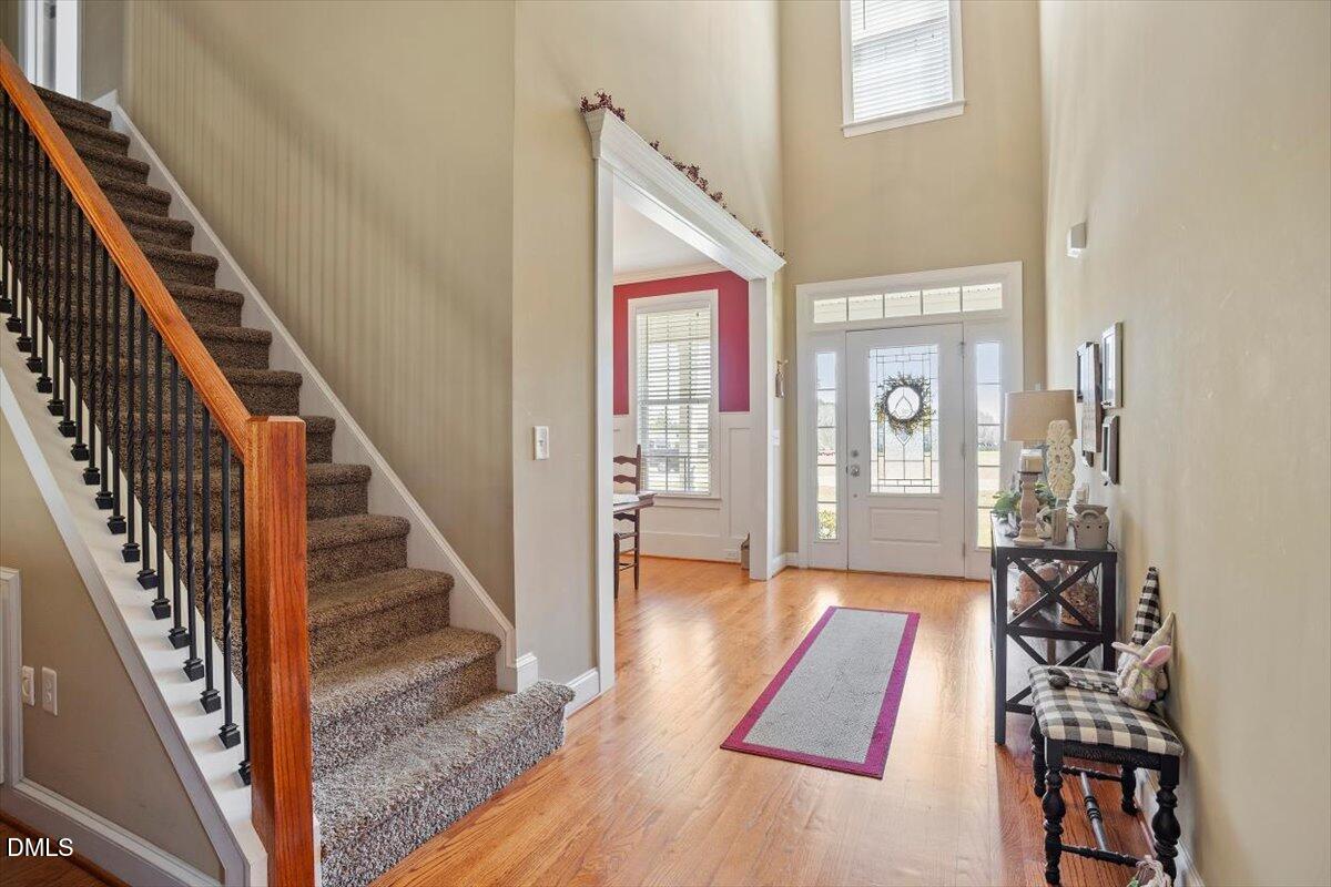 1001 Bellewood Farms Road Raleigh, NC 27603 - Photo 12 of 39 a view of an entryway with wooden floor