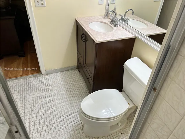 a bathroom with a glass shower door