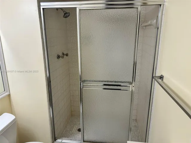 a living room with furniture and a lamp