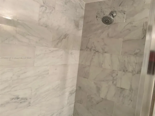 a view of a house with a big yard and large tree