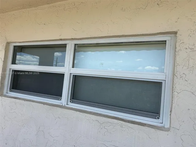 a view of a garden with an outdoor seating