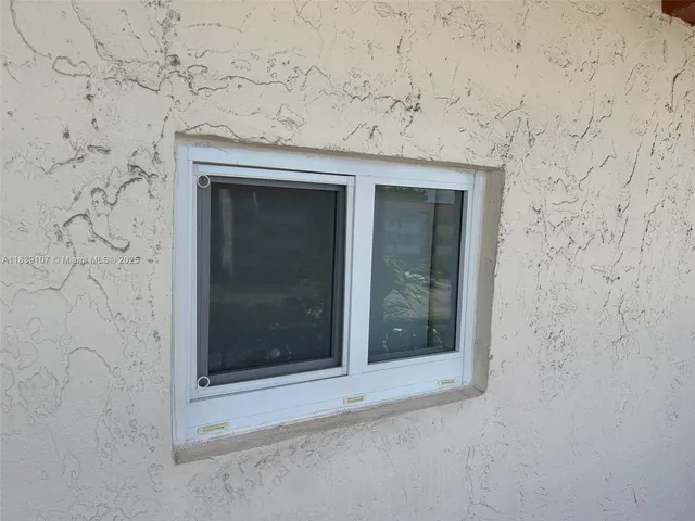a view of a patio with dining table and chairs with a fire pit