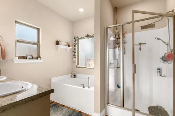 a en suite bathroom with a sink and a mirror