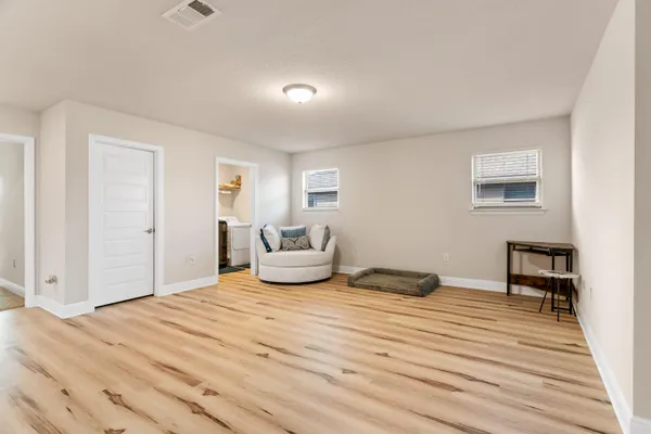 a view of livingroom with furniture and staircase