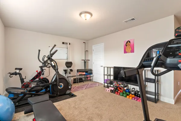 a view of a house with wooden fence