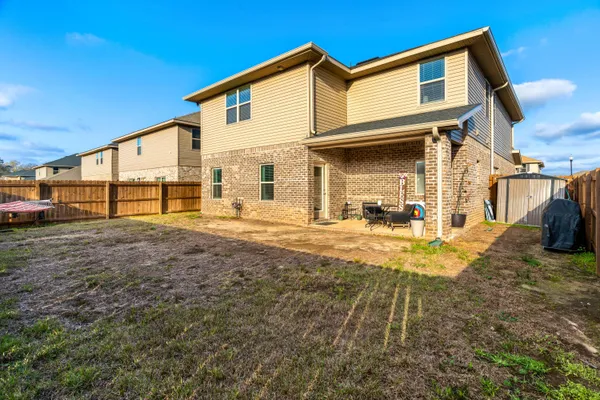 an aerial view of houses with outdoor space