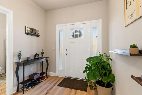a view of a workspace with furniture and a potted plant