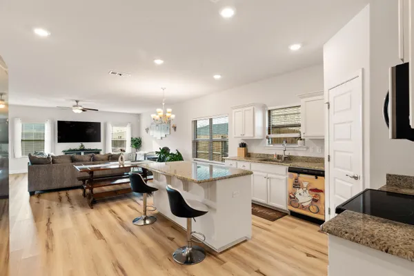 a living room with fireplace furniture and a flat screen tv
