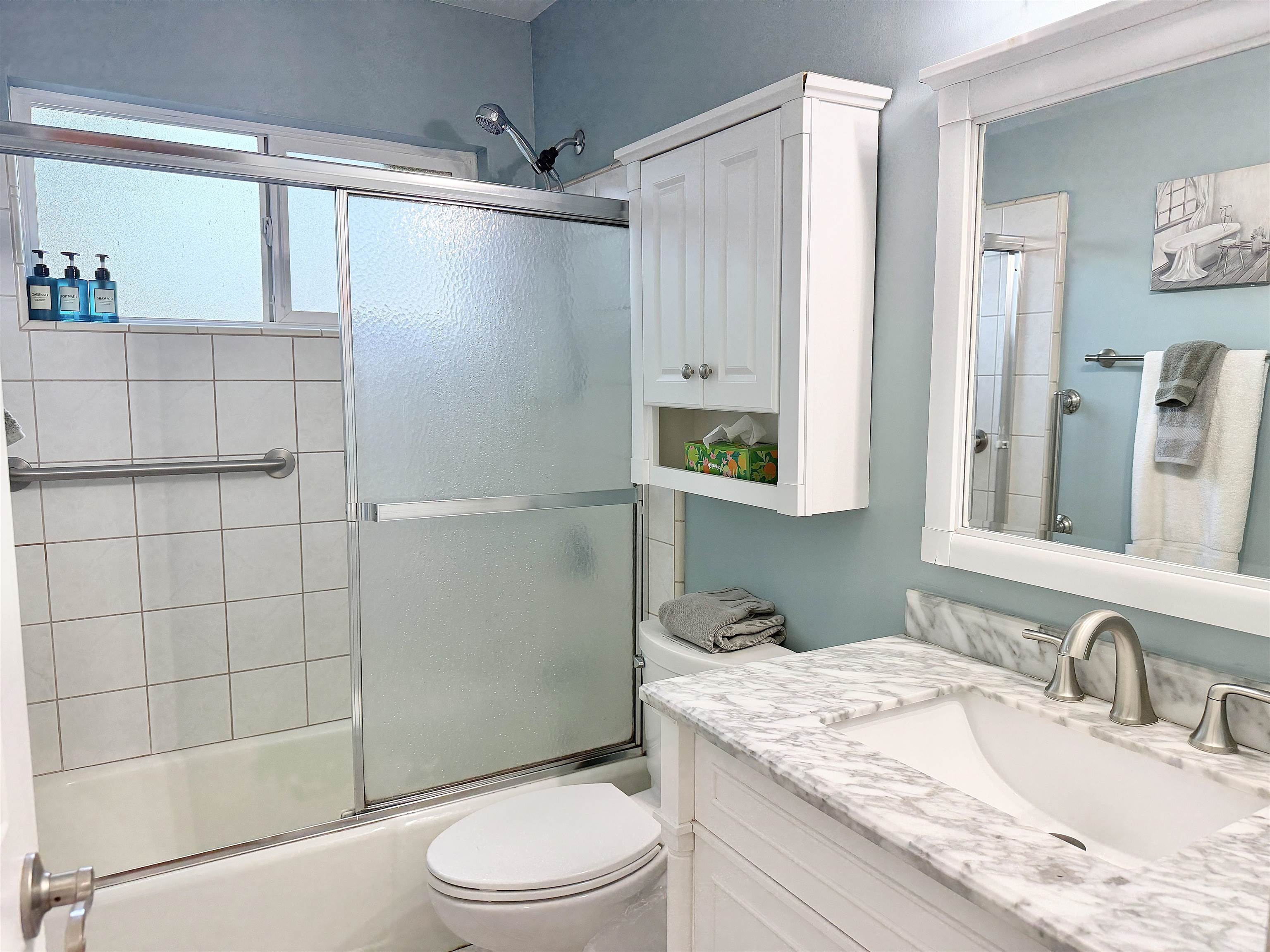 61 North Kihei Road, Unit 18 Kihei, HI 96753 - Photo 12 of 23 a bathroom with a granite countertop sink a toilet and shower