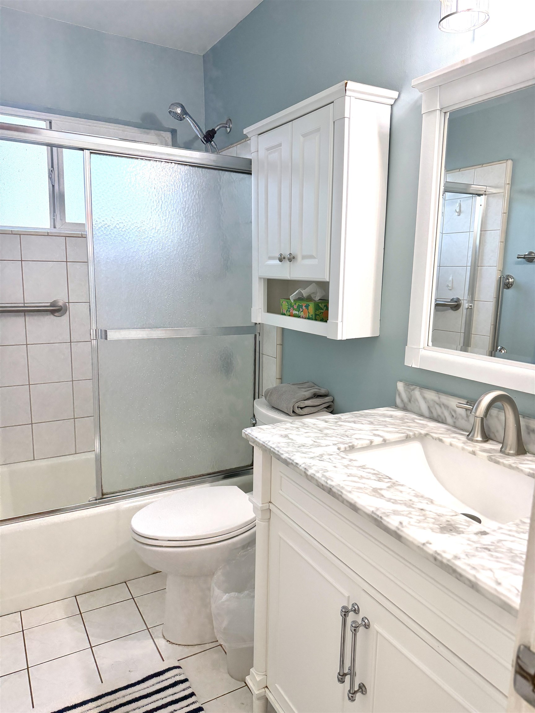 61 North Kihei Road, Unit 18 Kihei, HI 96753 - Photo 13 of 23 a bathroom with a granite countertop sink toilet a mirror and shower