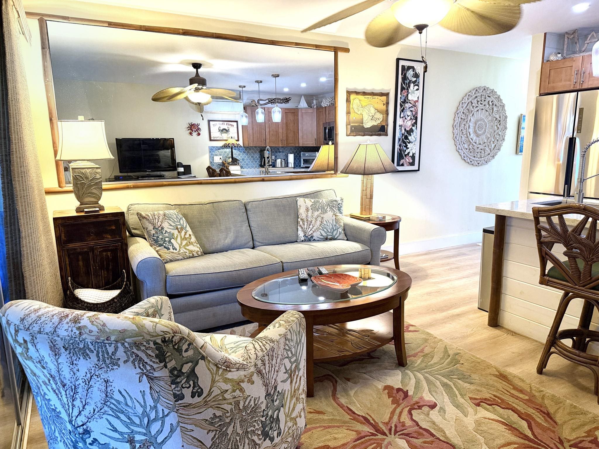 61 North Kihei Road, Unit 18 Kihei, HI 96753 - Photo 14 of 23 a living room with furniture and a wooden floor