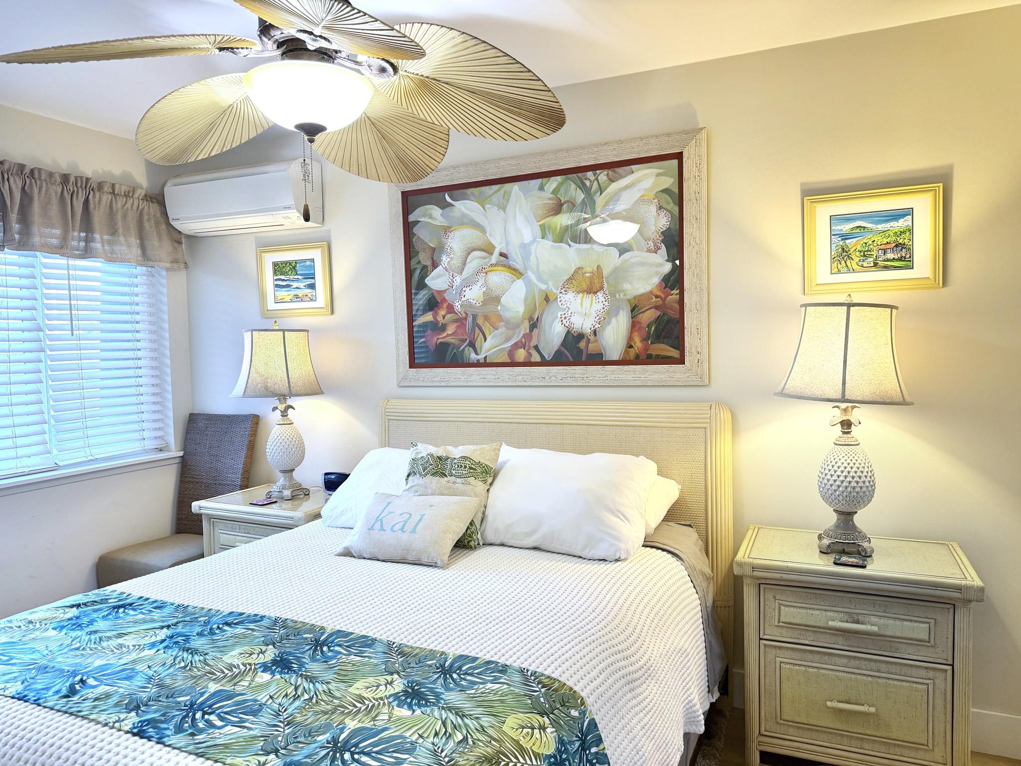 61 North Kihei Road, Unit 18 Kihei, HI 96753 - Photo 10 of 23 a bedroom with a bed and a painting on the wall