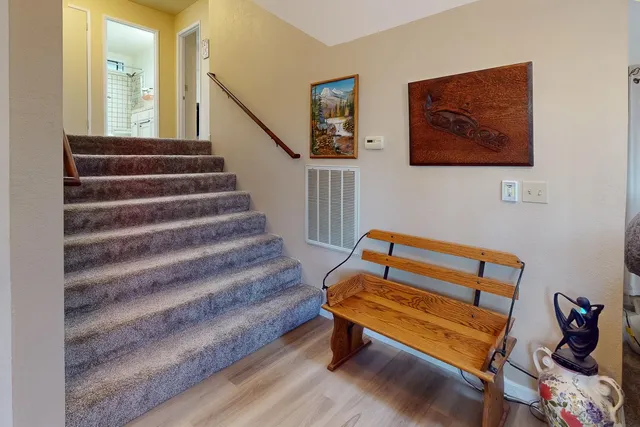 a spacious bedroom with a bed and large window
