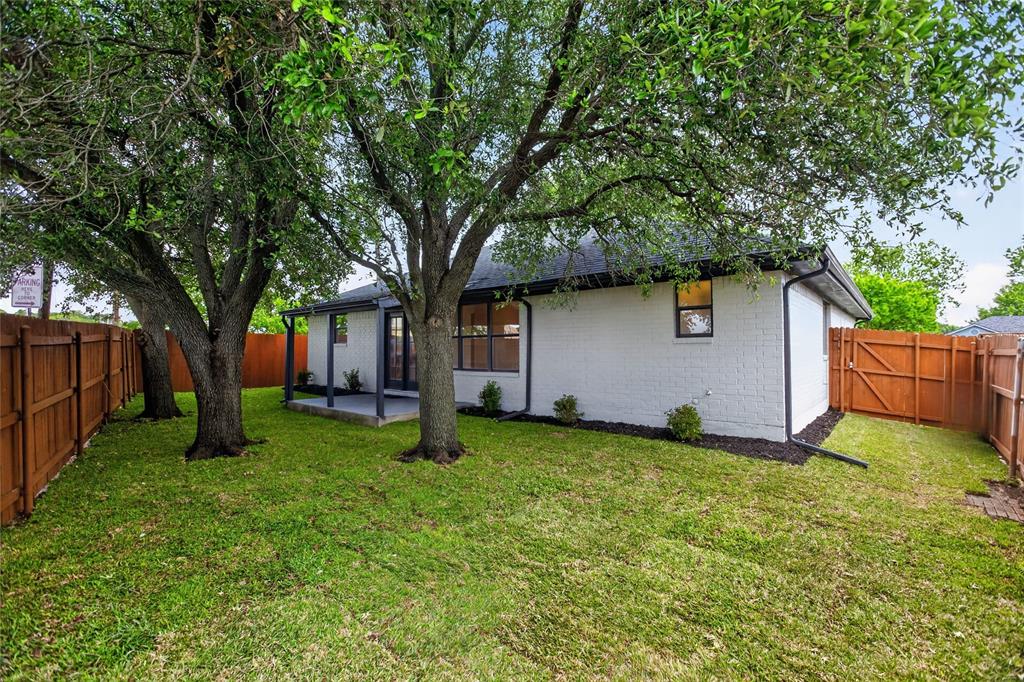 509 Brookside Court Burleson, TX 76028 - Photo 18 of 18 a view of a backyard with a house
