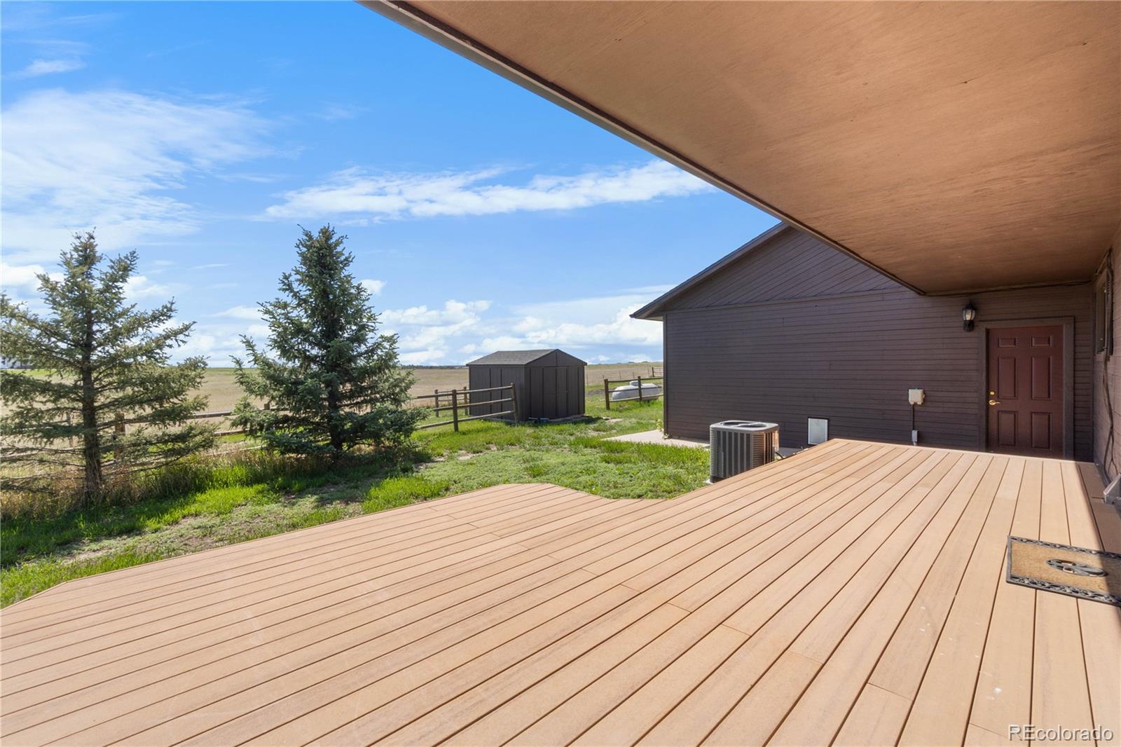 74 Rocky Cliff Road Elizabeth, CO 80107 - Photo 50 of 50 a outdoor view with wooden floor and fence