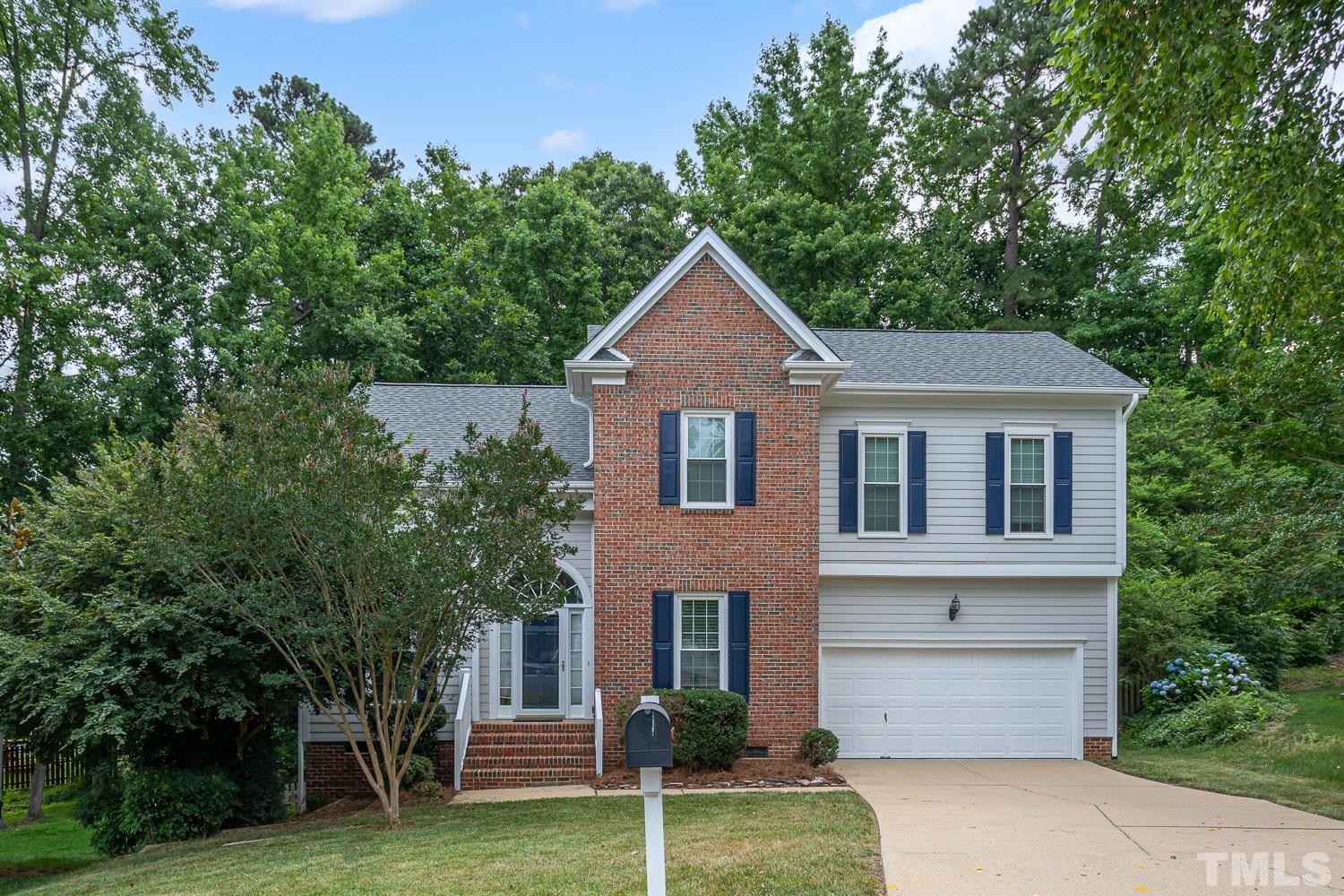5304 Back Sail Court Raleigh, NC 27613 - Photo 1 of 22 a front view of a house with a garden and yard