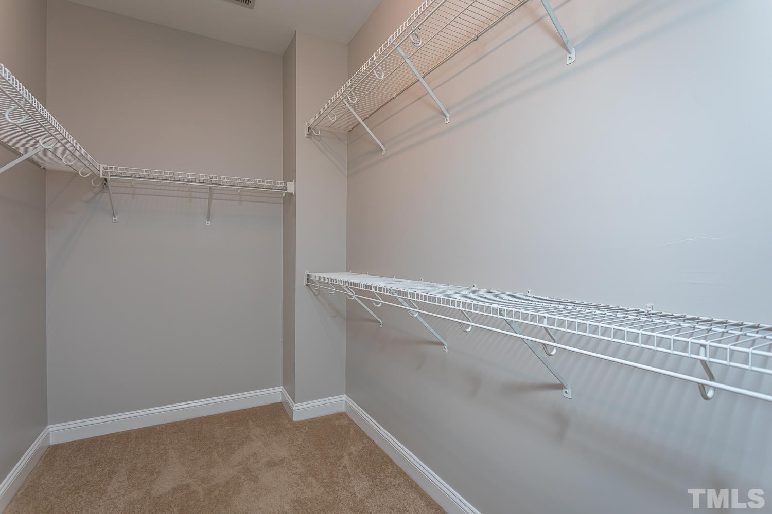 5304 Back Sail Court Raleigh, NC 27613 - Photo 14 of 22 a view of a room with racks on the wall