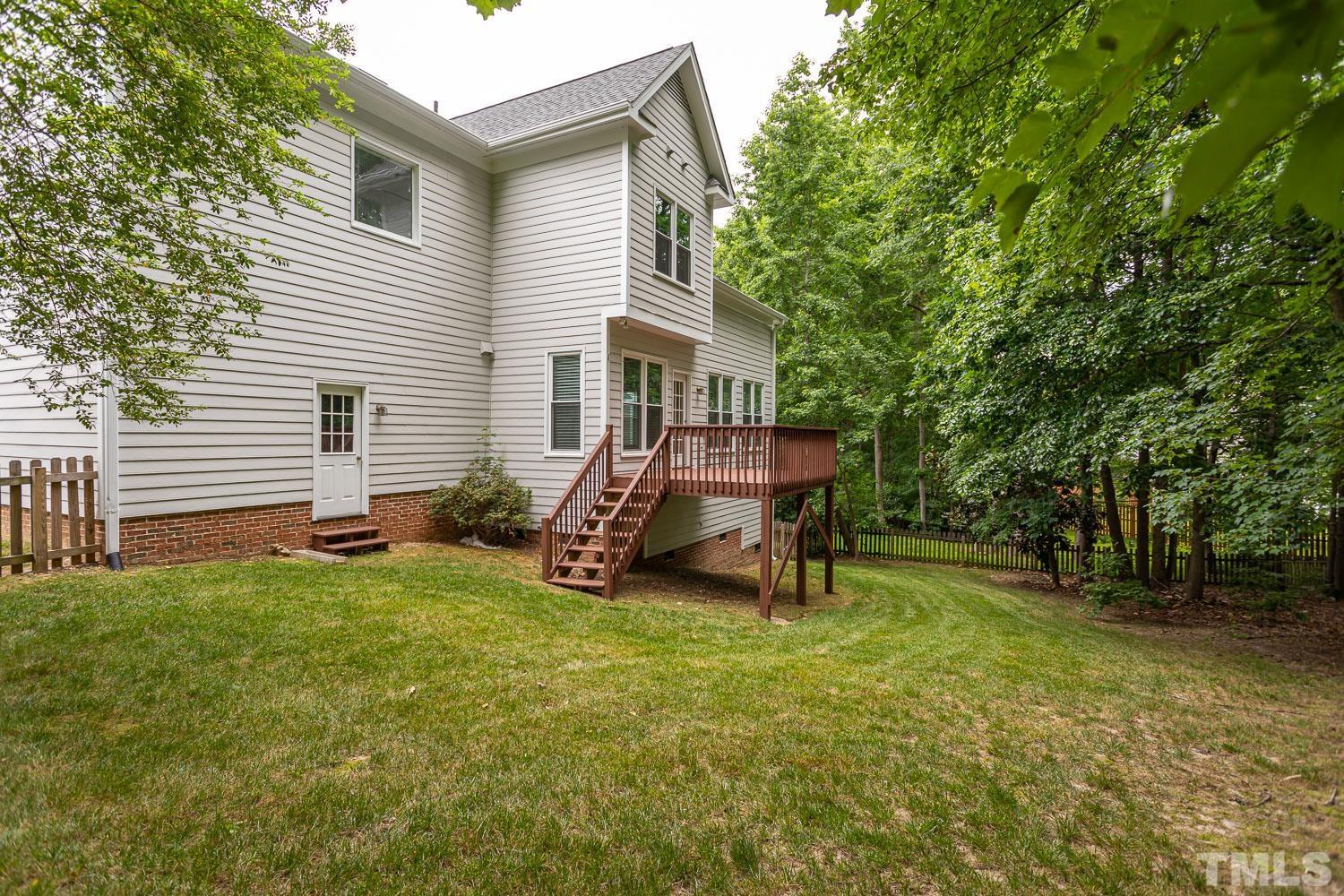 5304 Back Sail Court Raleigh, NC 27613 - Photo 20 of 22 a view of a house with backyard and a tree