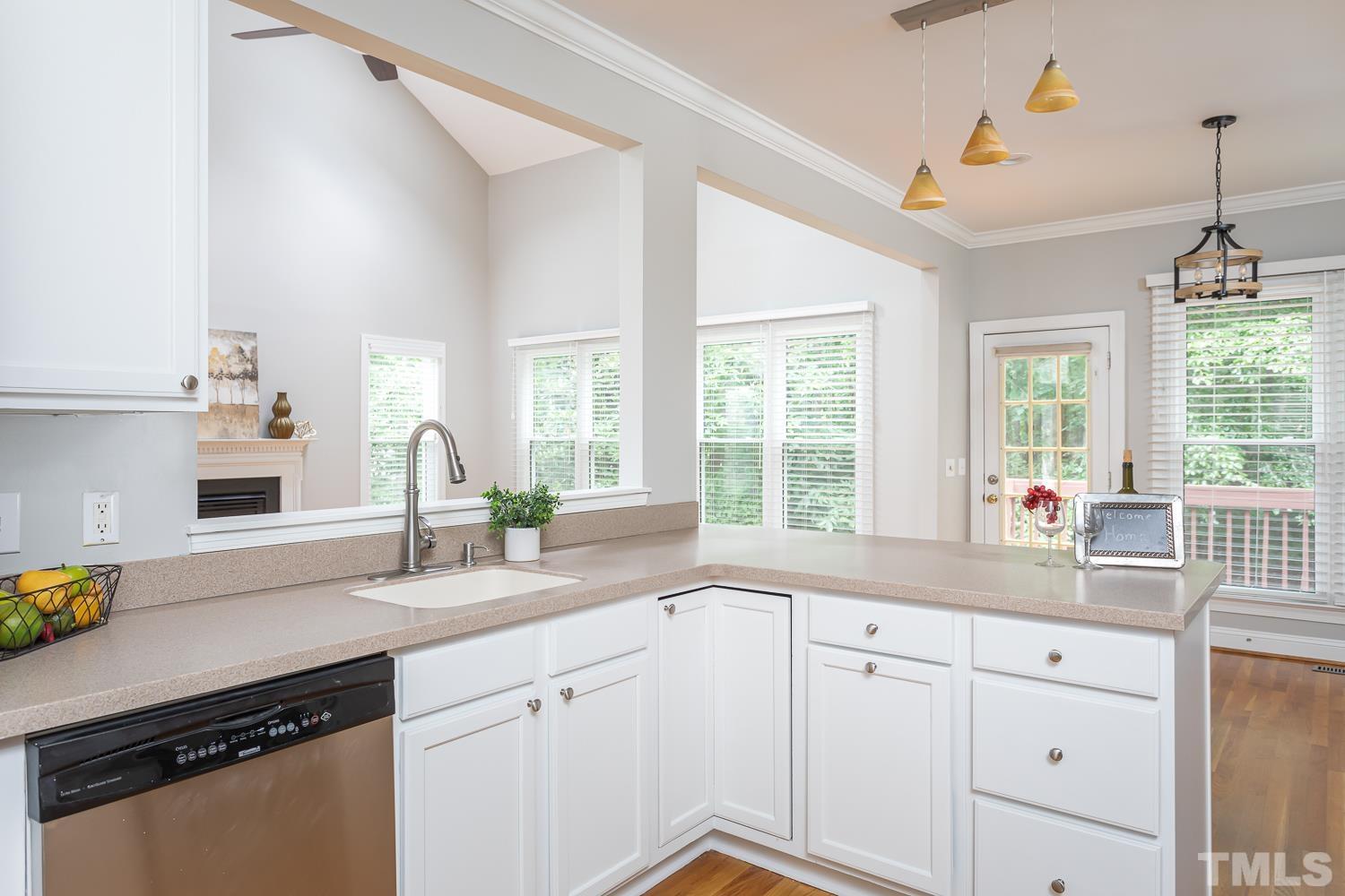 5304 Back Sail Court Raleigh, NC 27613 - Photo 5 of 22 a kitchen with granite countertop stainless steel appliances sink and window