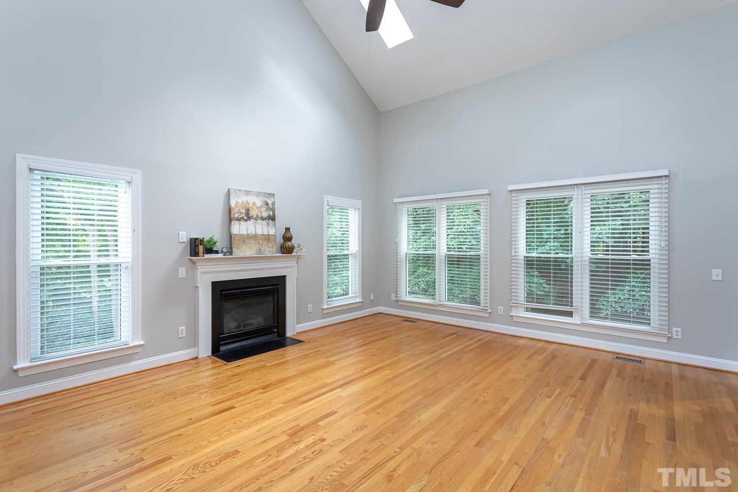 5304 Back Sail Court Raleigh, NC 27613 - Photo 9 of 22 a view of an empty room with a window and fireplace